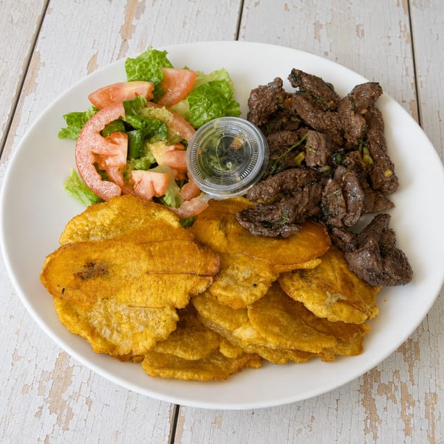 Churrasco A/gand Tostones / Skirt Steak Yellow Rice.